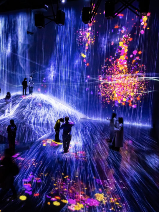 Tokyo, Japan - April, 2022: Digital Arts being exhibited at TeamLab Borderless, augmented reality and virtual reality themed museum where visitor can be a part of arts. Abstract and Colorful concept.